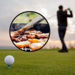Image of golf ball on a tee with golfer in background